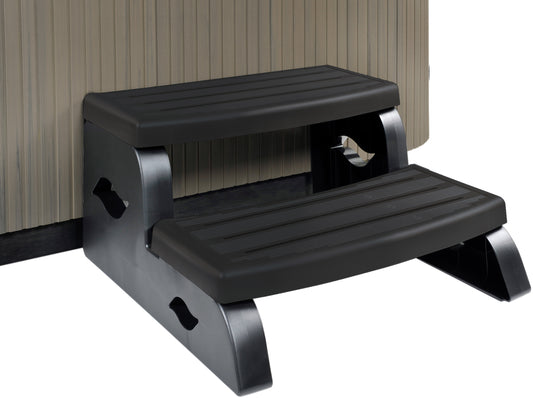 A black step designed for pool or spa access, featuring a slip-resistant tread and a locking mechanism.